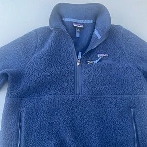 It is in perfect condition.  It is a blue Patagonia half zip sweatshirt.